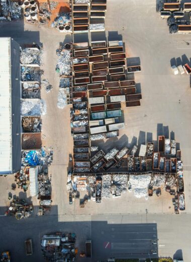 Drone shot of a recycling yard in Regensburg, Germany with containers and sorted materials.